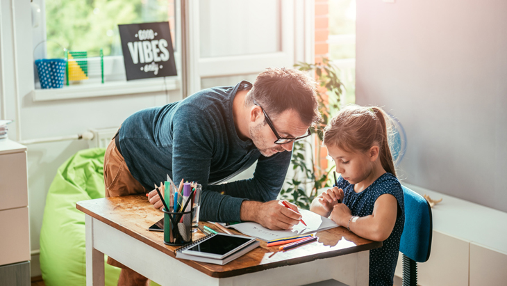 College Plan – Father and daughter working on homework