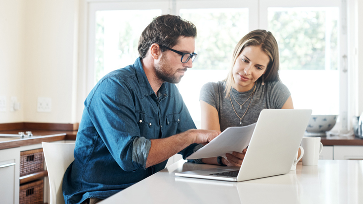 Life Insurance - Young couple doing their taxes