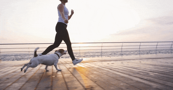 millennials - woman running with dog